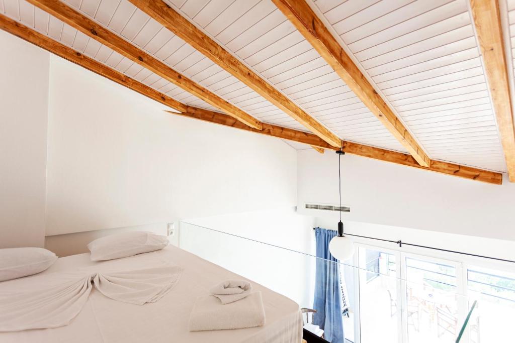Postel nebo postele na pokoji v ubytování Toni Retzo Rooms