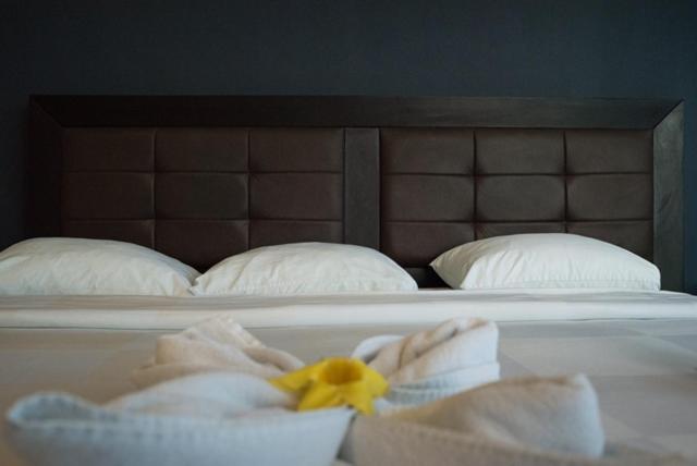 Postel nebo postele na pokoji v ubytování Hotel Noor