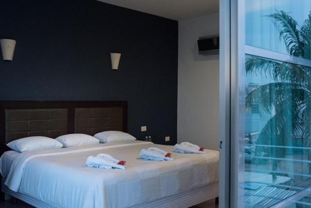 Postel nebo postele na pokoji v ubytování Hotel Noor