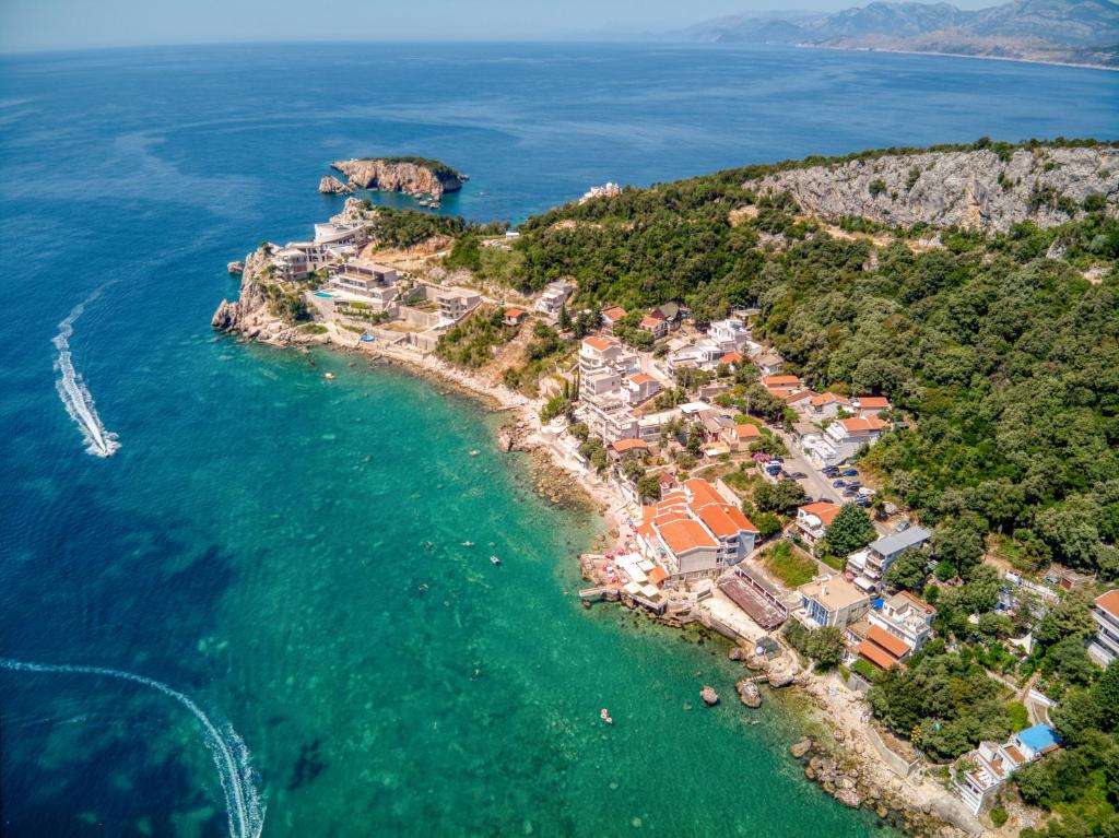 an aerial view of a resort on the ocean at Villa Krofnica in Ulcinj