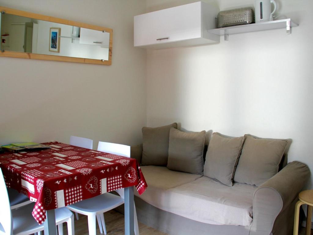 a living room with a couch and a table at Appartement Valloire, 1 pièce, 4 personnes - FR-1-263-481 in Valloire