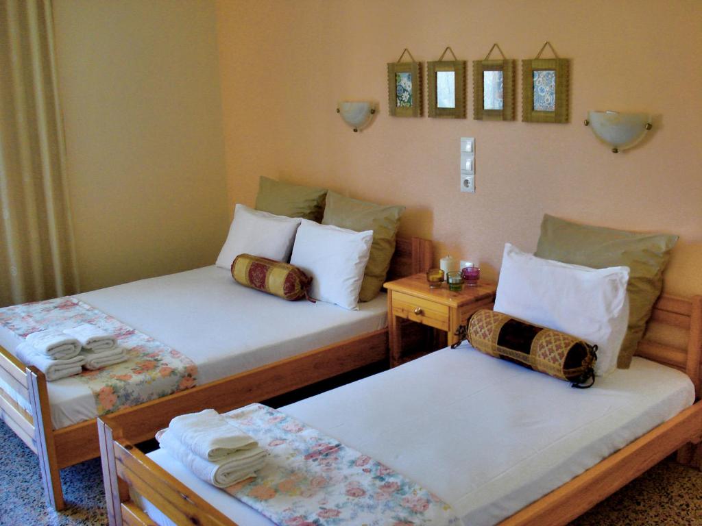 Łóżko lub łóżka w pokoju w obiekcie Kochili Apartments
