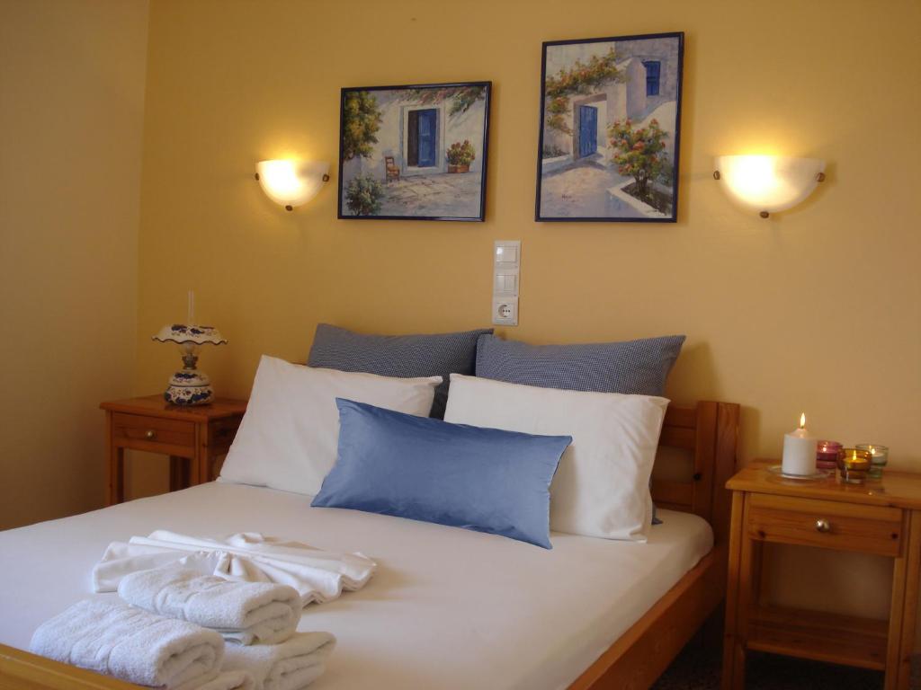 Łóżko lub łóżka w pokoju w obiekcie Kochili Apartments