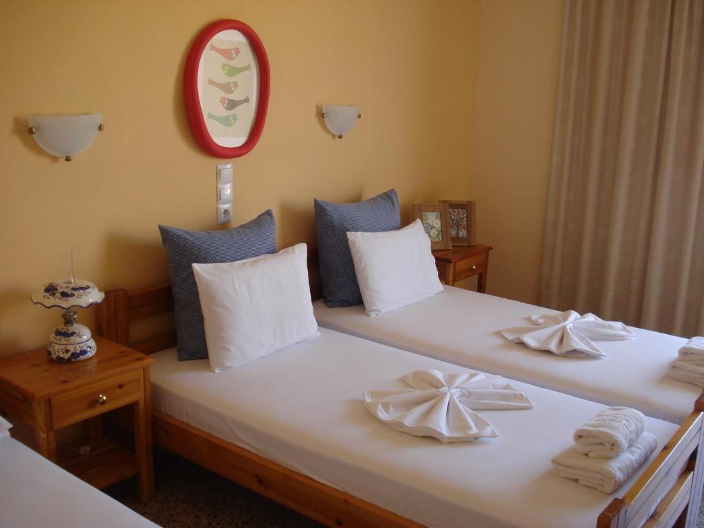 Łóżko lub łóżka w pokoju w obiekcie Kochili Apartments