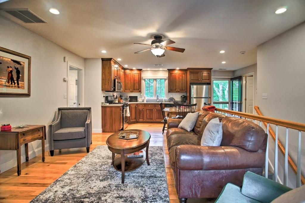 a living room with a couch and a table at Cape Cod Home with Deck about 3 Mi to Beaches in Bourne