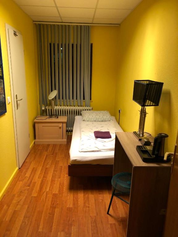 Postel nebo postele na pokoji v ubytování Astoria Hotel Heimbach