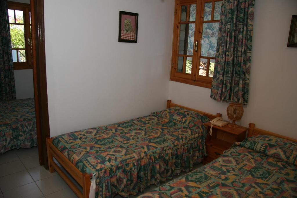 Postel nebo postele na pokoji v ubytování Circe Pansion