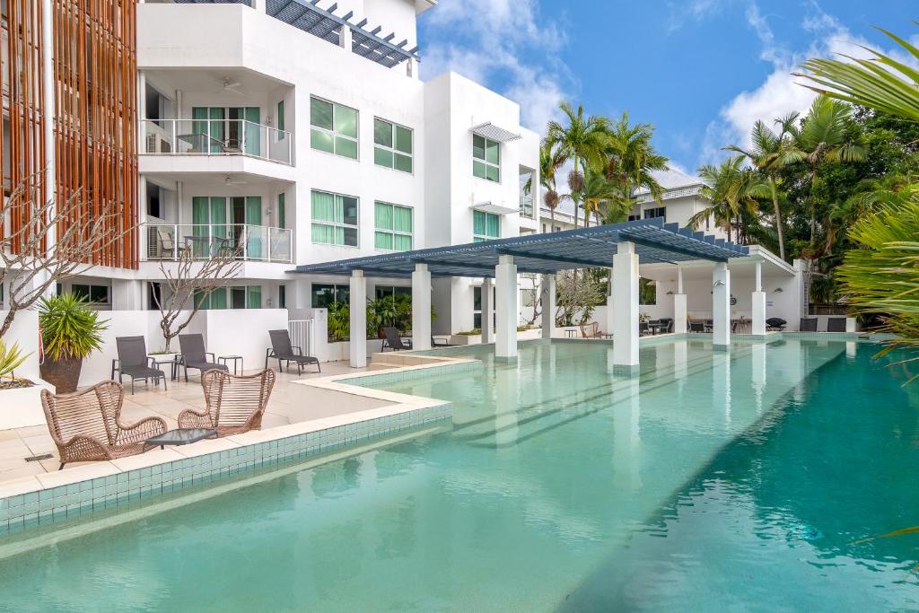 a swimming pool in front of a building at 201 Lake Street in Cairns