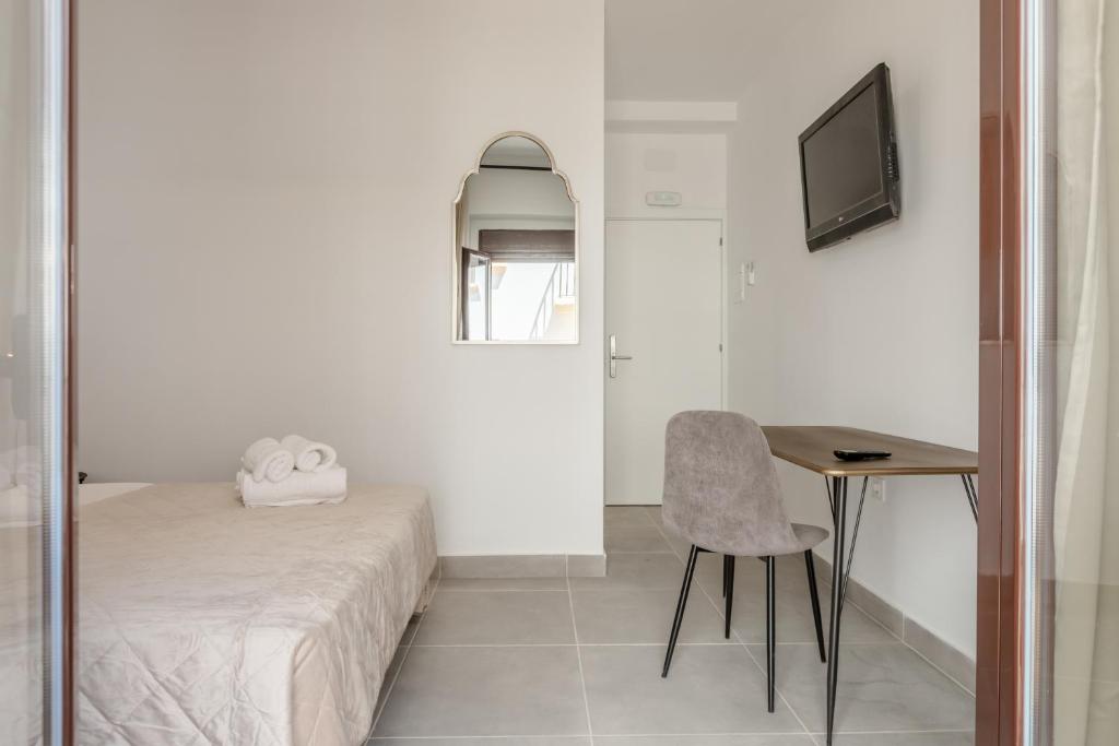 TV a/nebo společenská místnost v ubytování Villamarta Boutique Rooms