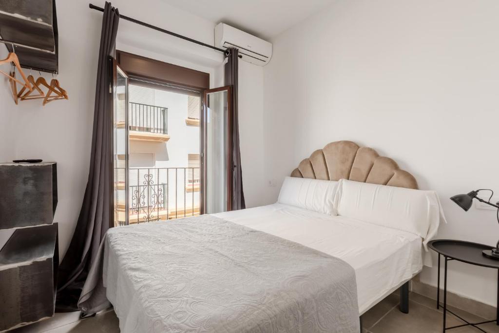 Postel nebo postele na pokoji v ubytování Villamarta Boutique Rooms