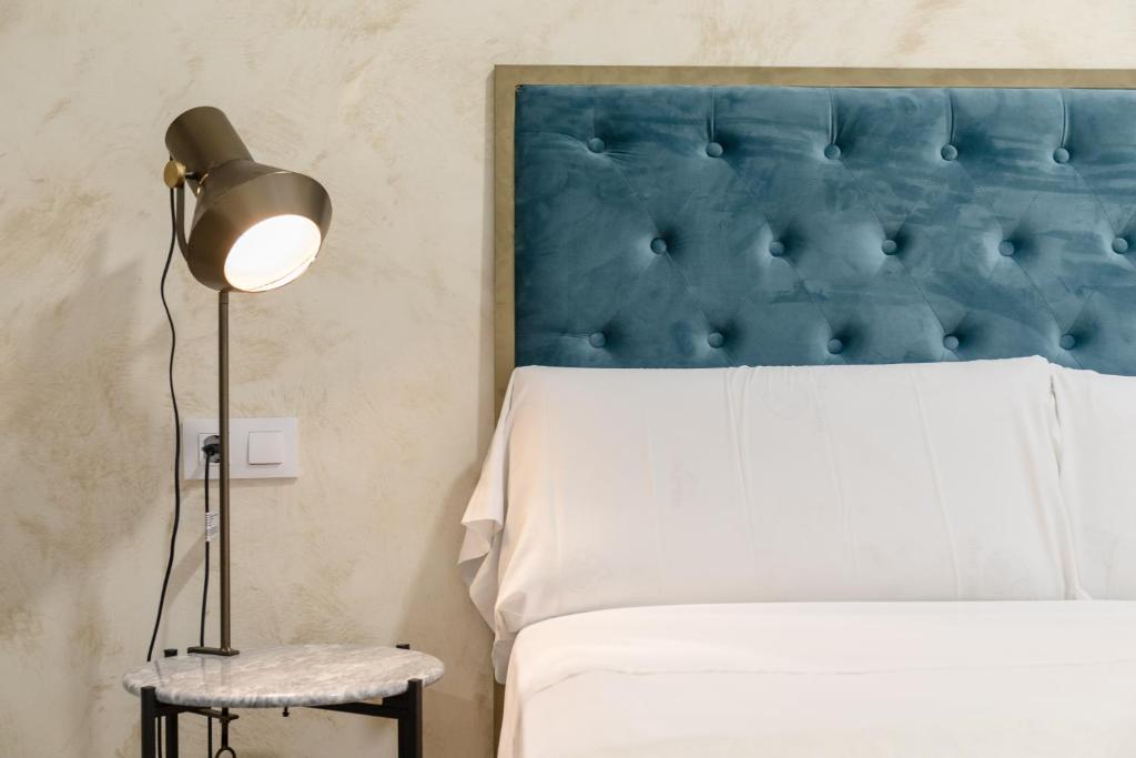 Postel nebo postele na pokoji v ubytování Villamarta Boutique Rooms