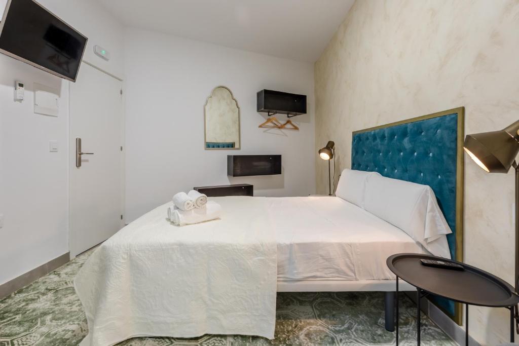 Postel nebo postele na pokoji v ubytování Villamarta Boutique Rooms