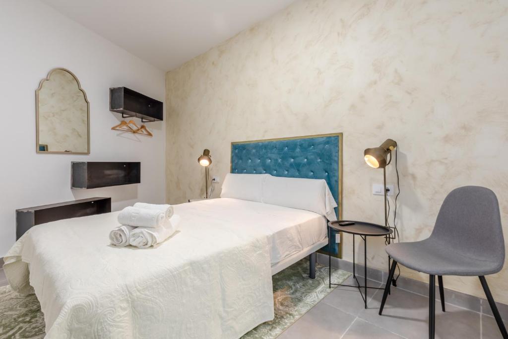 Postel nebo postele na pokoji v ubytování Villamarta Boutique Rooms