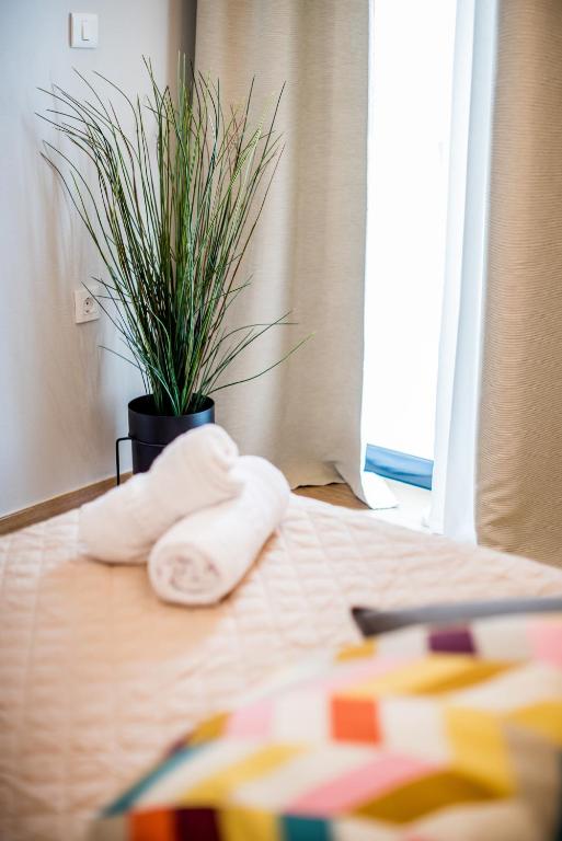 A bed or beds in a room at Evangeline Maisons