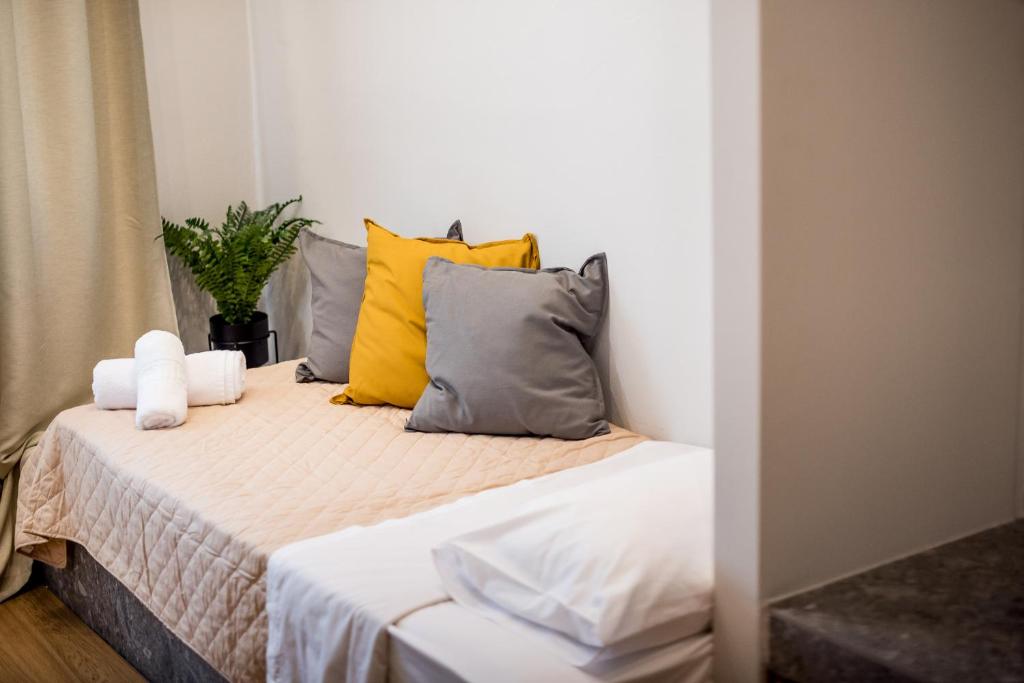 A bed or beds in a room at Evangeline Maisons