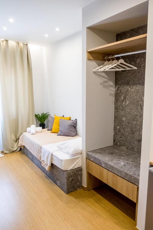 A bed or beds in a room at Evangeline Maisons