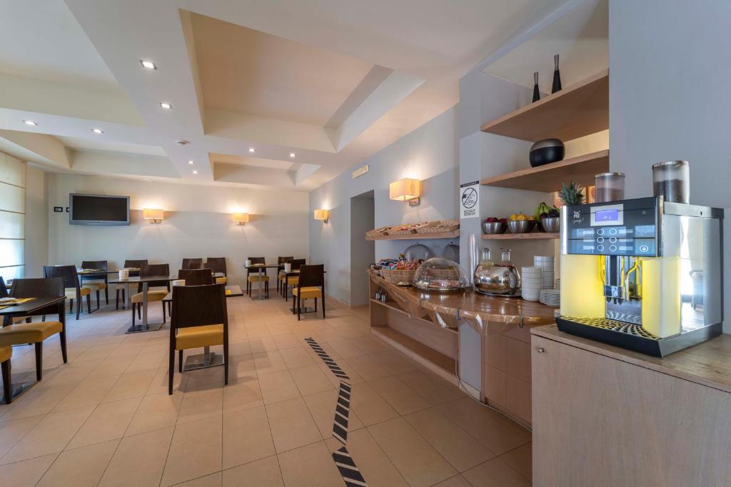 Kuchyň nebo kuchyňský kout v ubytování Hotel San Giuan
