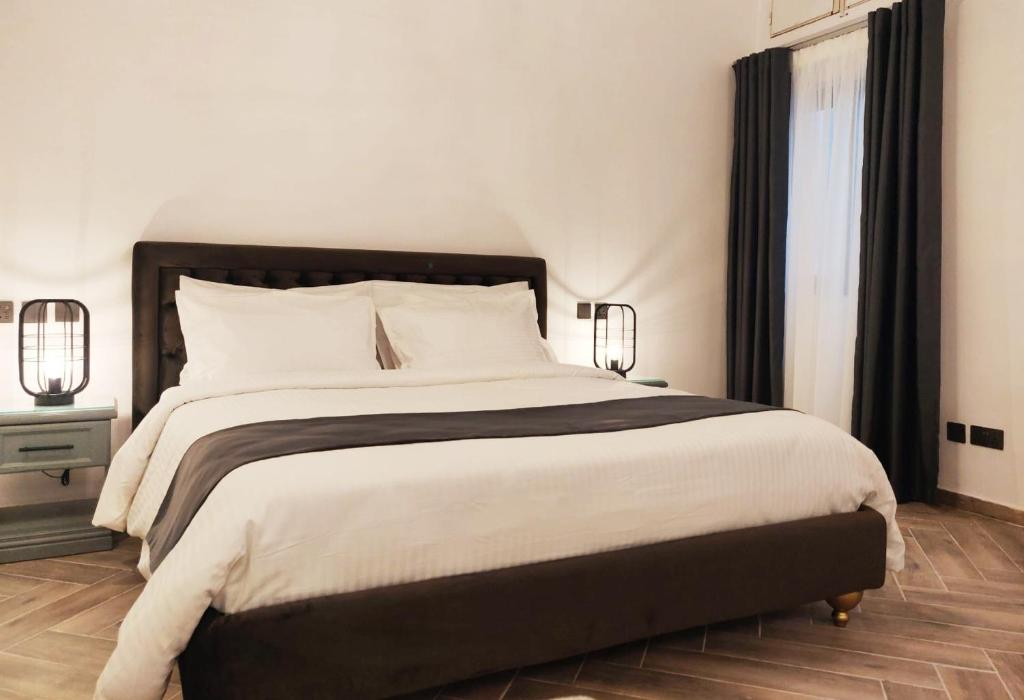 Postel nebo postele na pokoji v ubytování Casa Reale Boutique Hotel