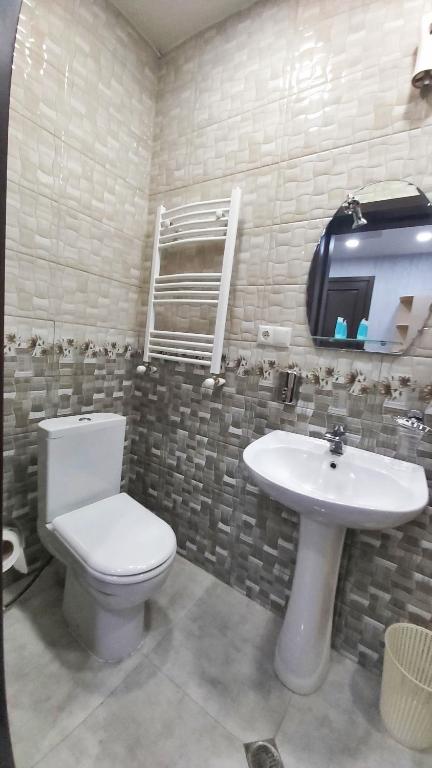 Koupelna v ubytování Gamarjoba Hotel