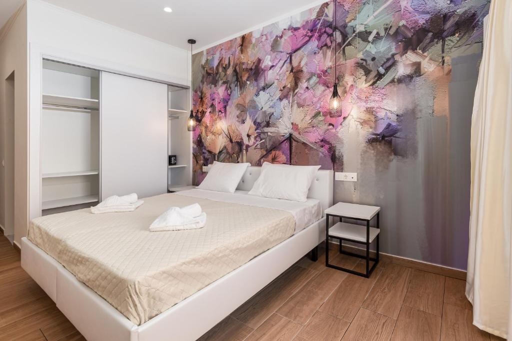 Postel nebo postele na pokoji v ubytování Aqua Luxury Suites by Estia