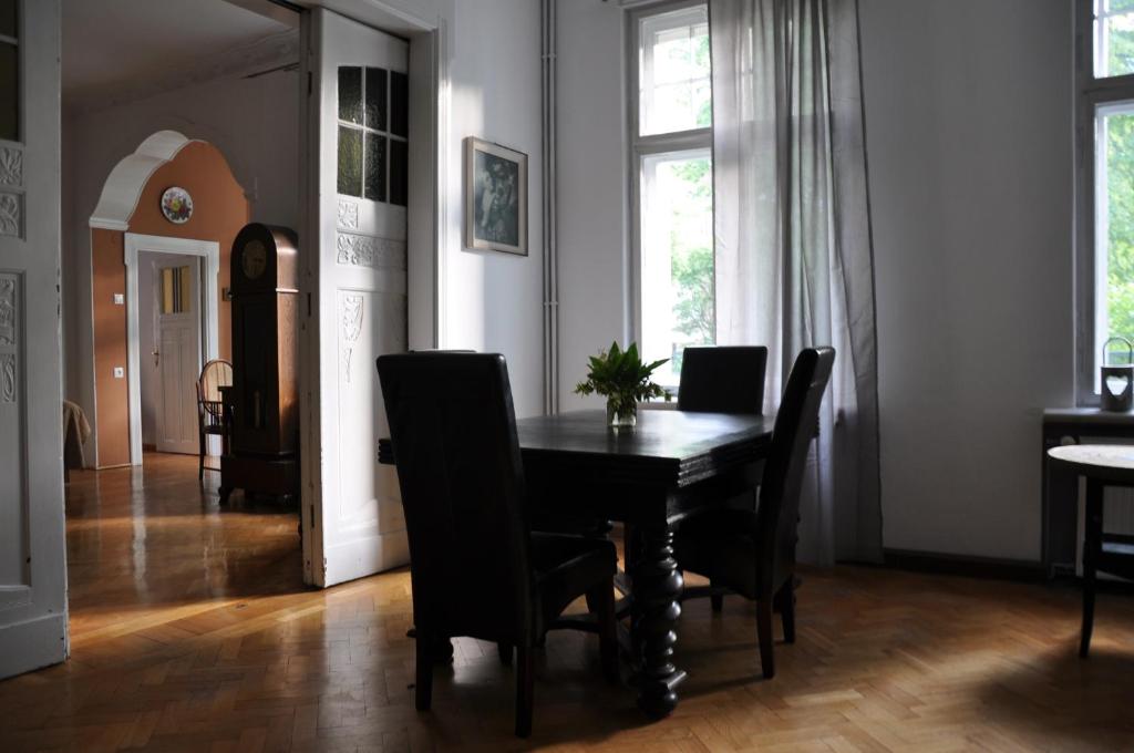 a dining room with a table and chairs at Apartament Sopot Andre in Sopot