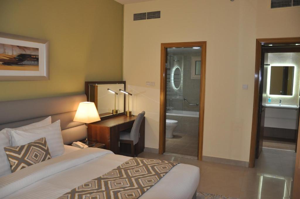 Postel nebo postele na pokoji v ubytování Radiance Premium Suites