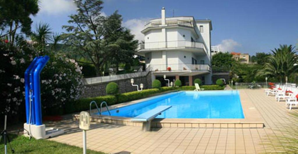 a swimming pool in front of a building at Villa Cinzia in Sant'Agnello