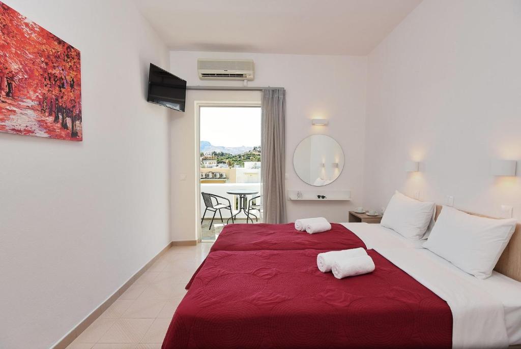 Postel nebo postele na pokoji v ubytování Afroditi Hotel