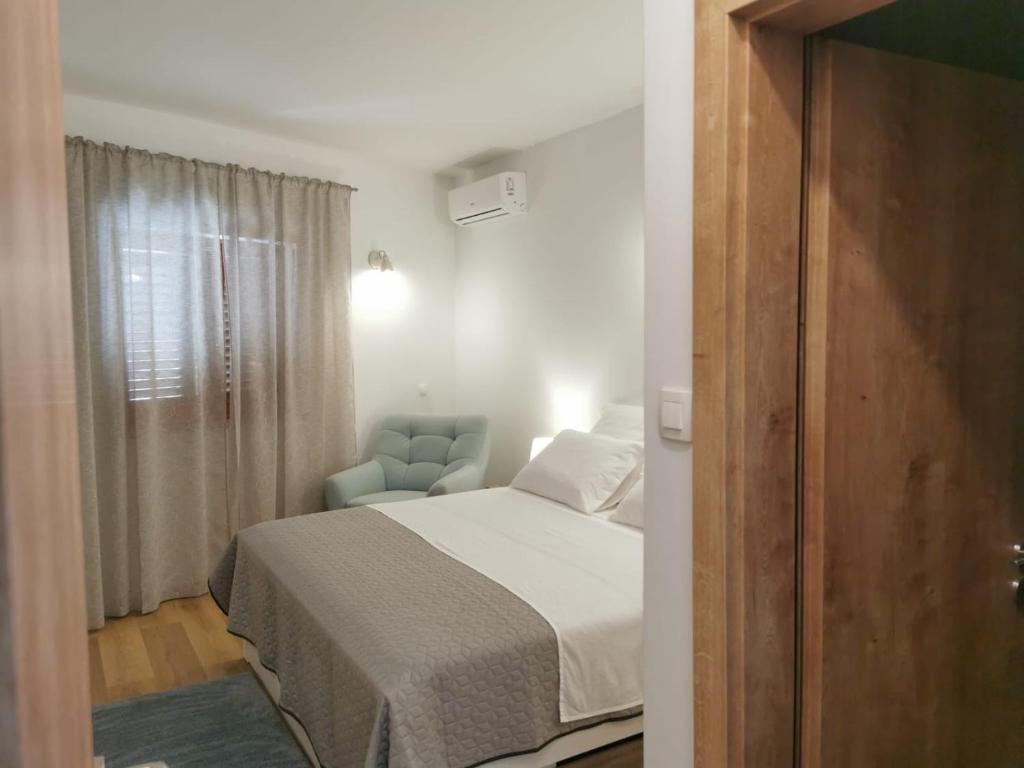 Postel nebo postele na pokoji v ubytování Apartman Kneže