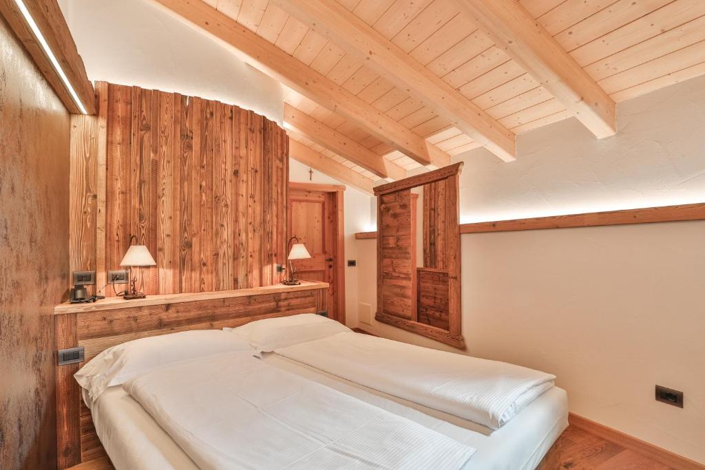 Postel nebo postele na pokoji v ubytování Garni Maso San Michele
