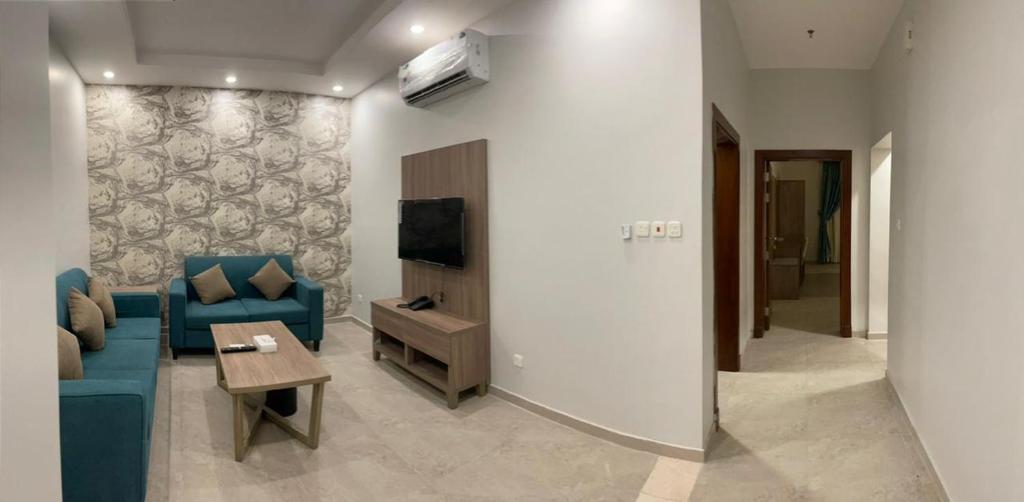 TV a/nebo společenská místnost v ubytování Al-Haramain Family Apartments