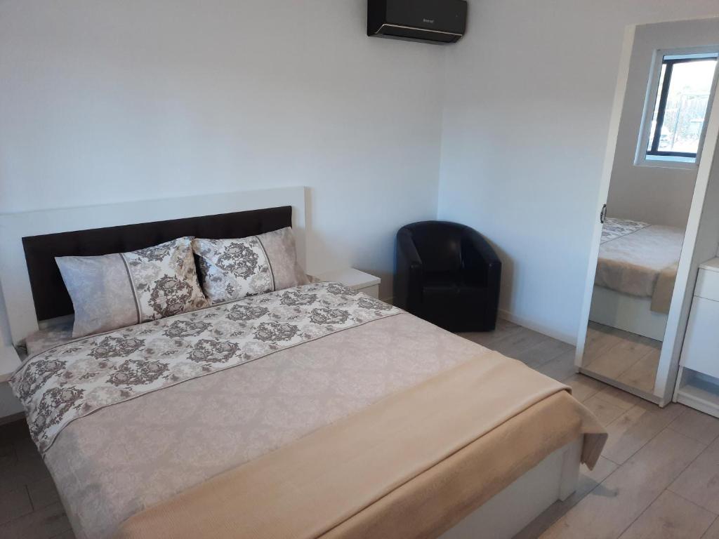 Postel nebo postele na pokoji v ubytování CASA GIA CALIMANESTI