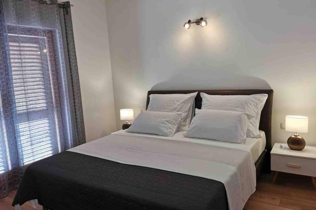 Posteľ alebo postele v izbe v ubytovaní Deluxe apartman “ Koromačna”
