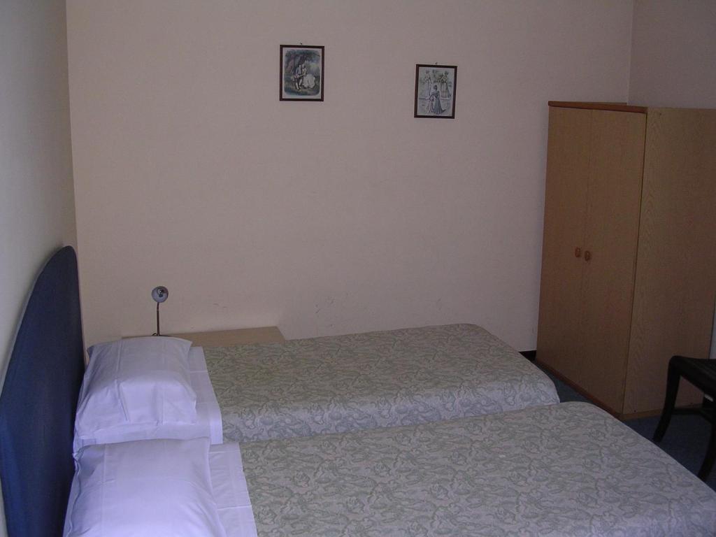 Postel nebo postele na pokoji v ubytování CerrutiHotel