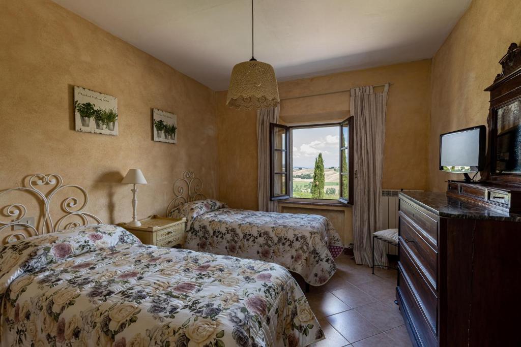 Postel nebo postele na pokoji v ubytování Agriturismo Percenna