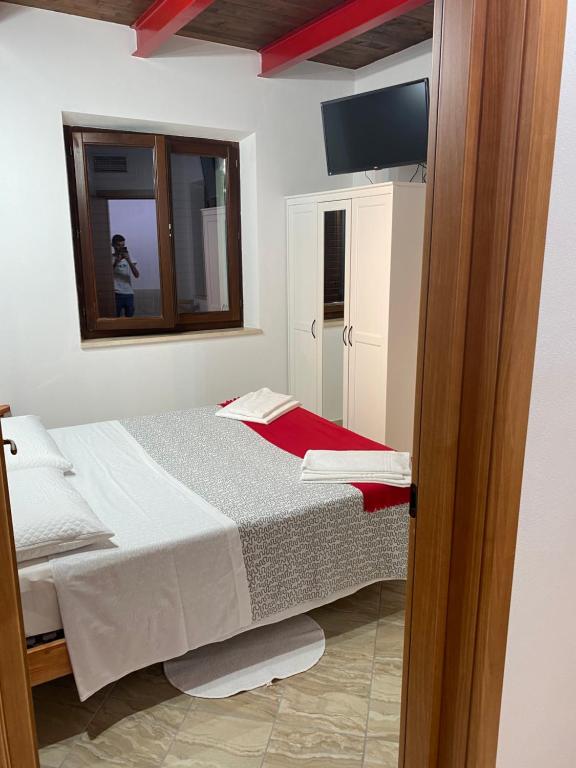 Postel nebo postele na pokoji v ubytování Colle Sul Lago
