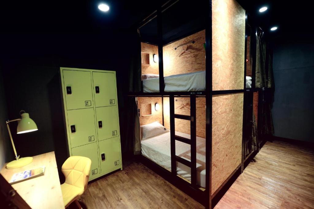 Postel nebo postele na pokoji v ubytování KID Hualien Hostel