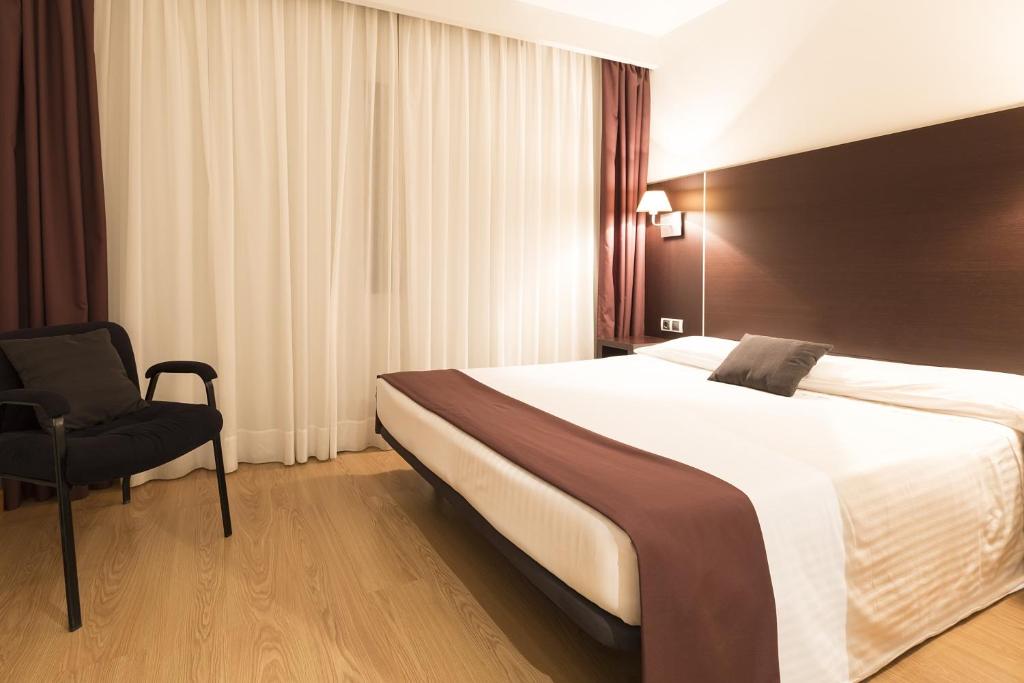 Postel nebo postele na pokoji v ubytování Hotel Plazaola