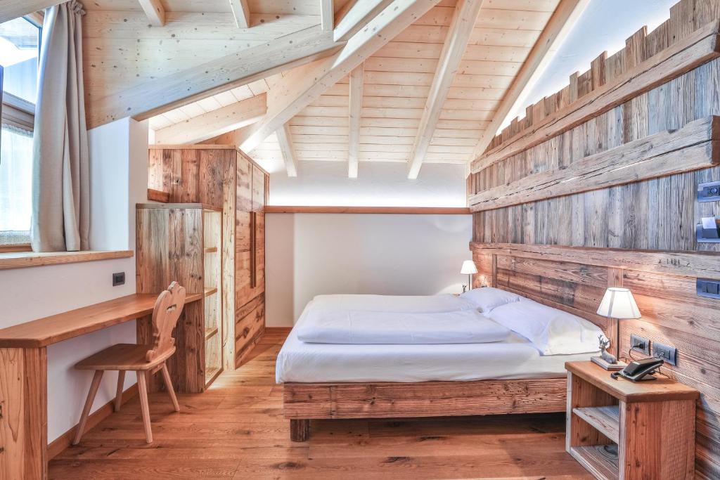 Postel nebo postele na pokoji v ubytování Garni Maso San Michele