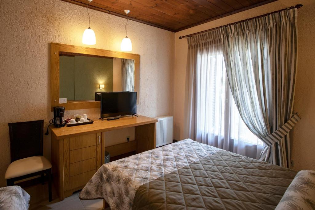 Postel nebo postele na pokoji v ubytování Asimina Guesthouse, Eptalofos Parnassos