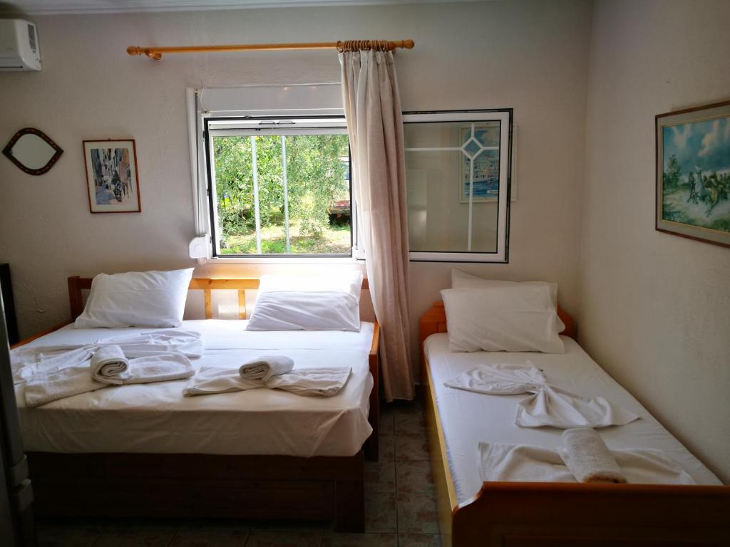 Postel nebo postele na pokoji v ubytování Cristi Apartments