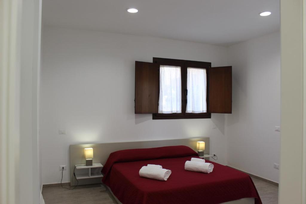 Postel nebo postele na pokoji v ubytování casa sandrina piano terra