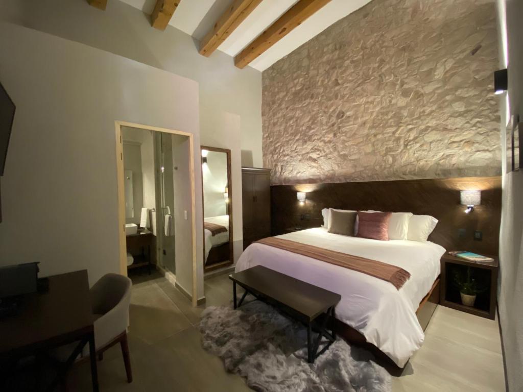 Postel nebo postele na pokoji v ubytování Hotel Casa Once
