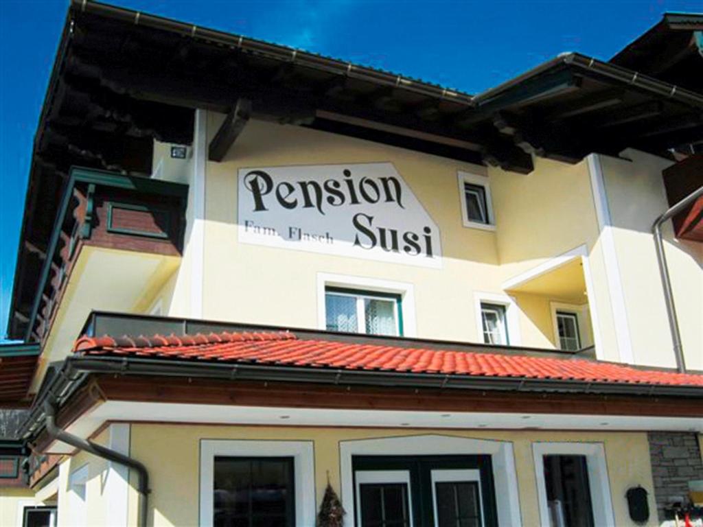 a building with a sign on the side of it at Pension Susi in Wagrain