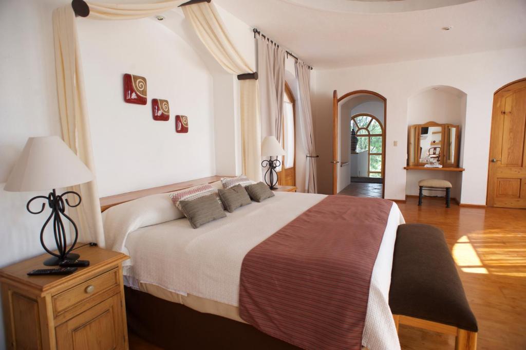 Postel nebo postele na pokoji v ubytování La Casona de los Colibríes
