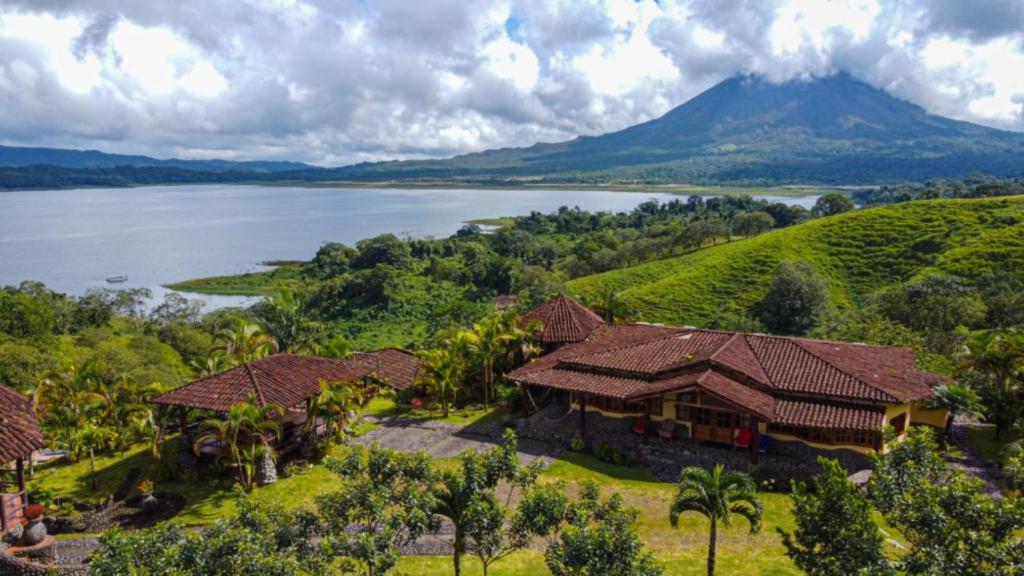 an aerial view of a house next to a lake at Pie in the Sky 3 Amazing Luxury Home with Lake and Volcano view in El Fosforo