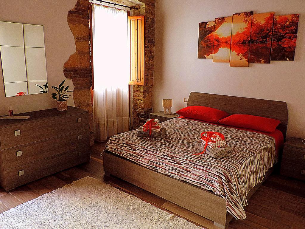 Postel nebo postele na pokoji v ubytování Sa Fabbrica de Sant'Anna