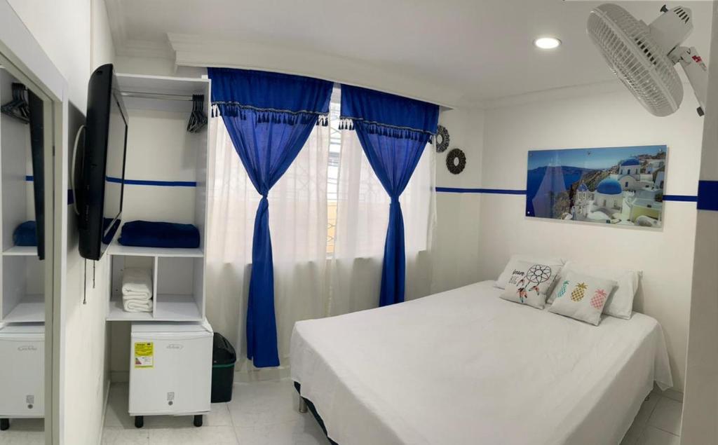 Postel nebo postele na pokoji v ubytování Casa Hotel Manco Mora
