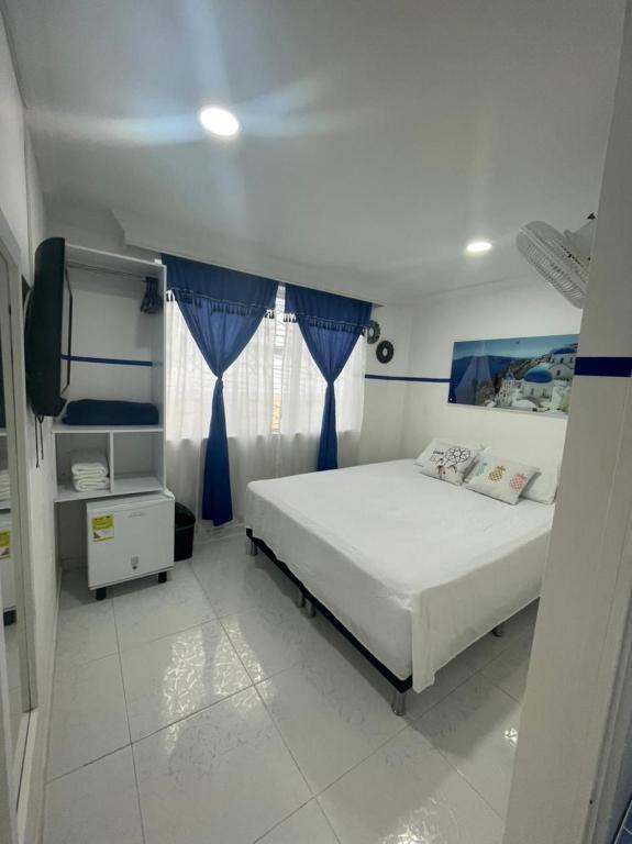 Postel nebo postele na pokoji v ubytování Casa Hotel Manco Mora