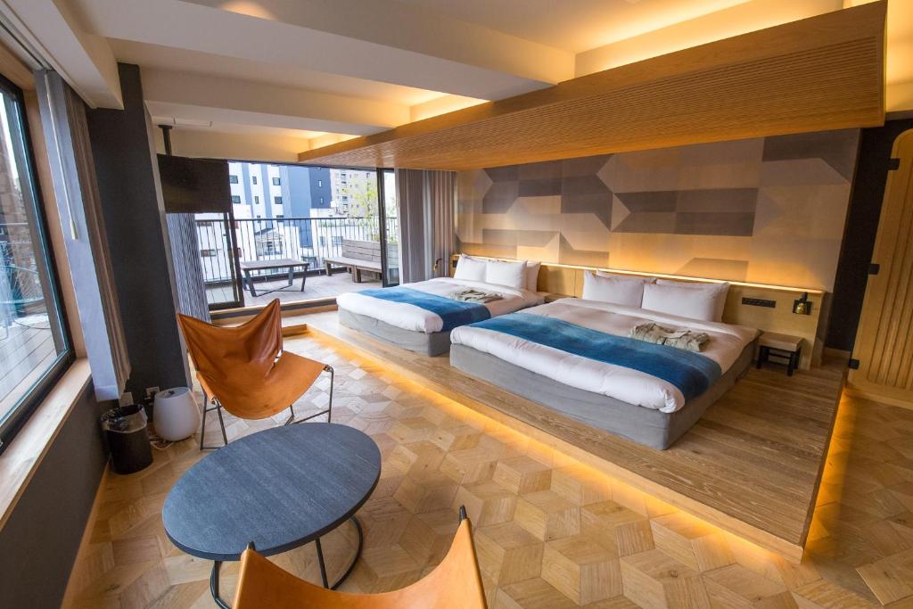Postel nebo postele na pokoji v ubytování Asakusa Kokono Club Hotel